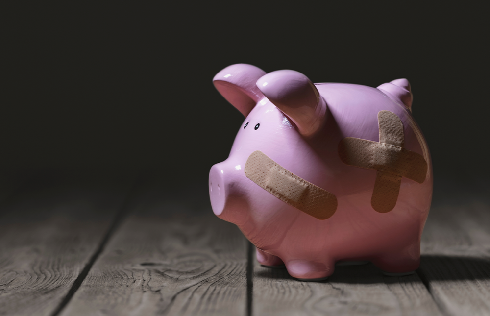 Piggybank with bandaids