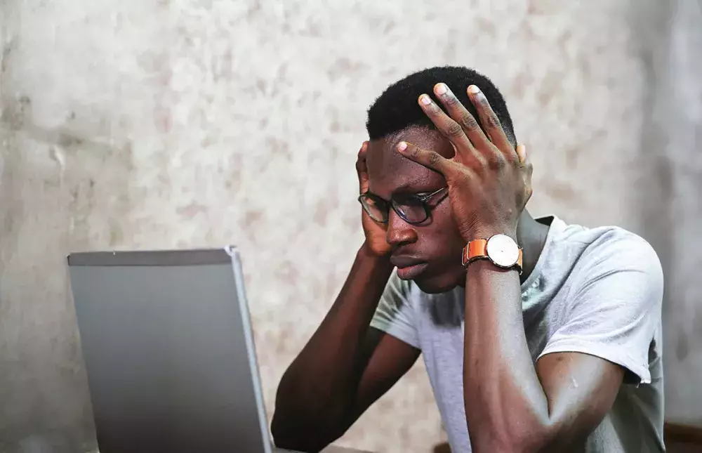 Guy in front of laptop.