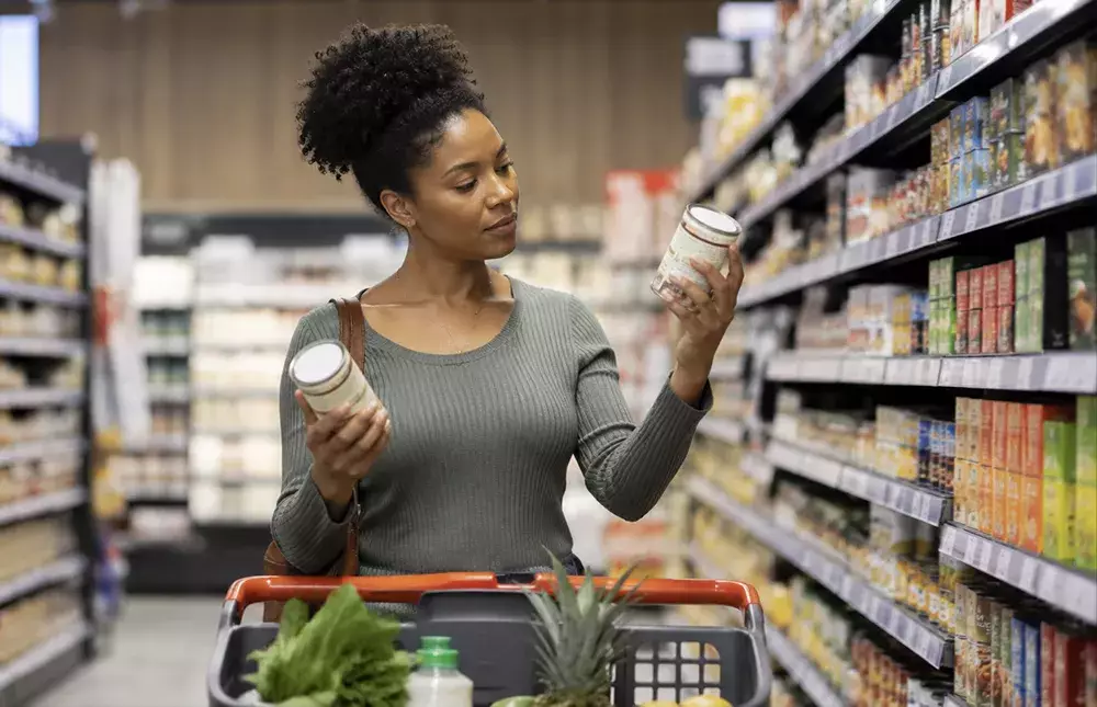Woman deciding between products